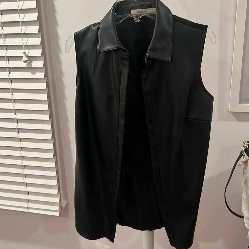 Leather vest- back of vest is material not leather